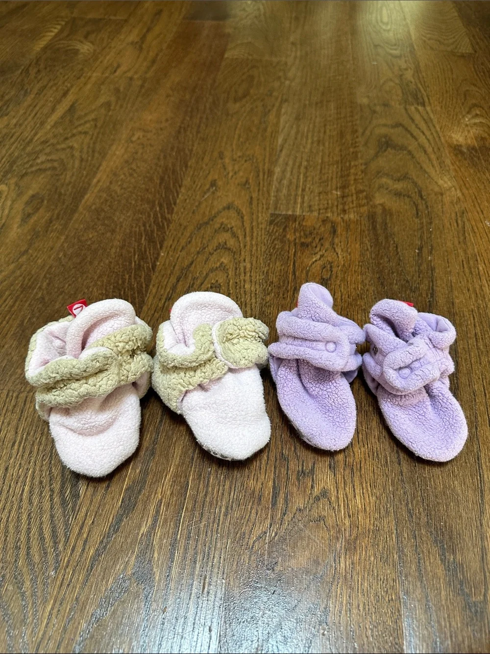 Two pairs of baby Zutano booties, 12M